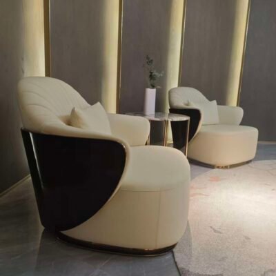 Embroidered back panel close up frosted fabric texture beige leather detail hospitality furniture craftsmanship artisanal textile work