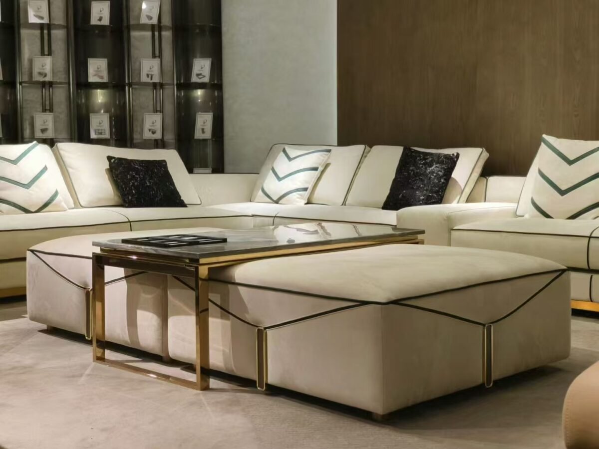 Luxury ottoman footrest in frosted cloth fabric with square silhouette styled in white and gold living room