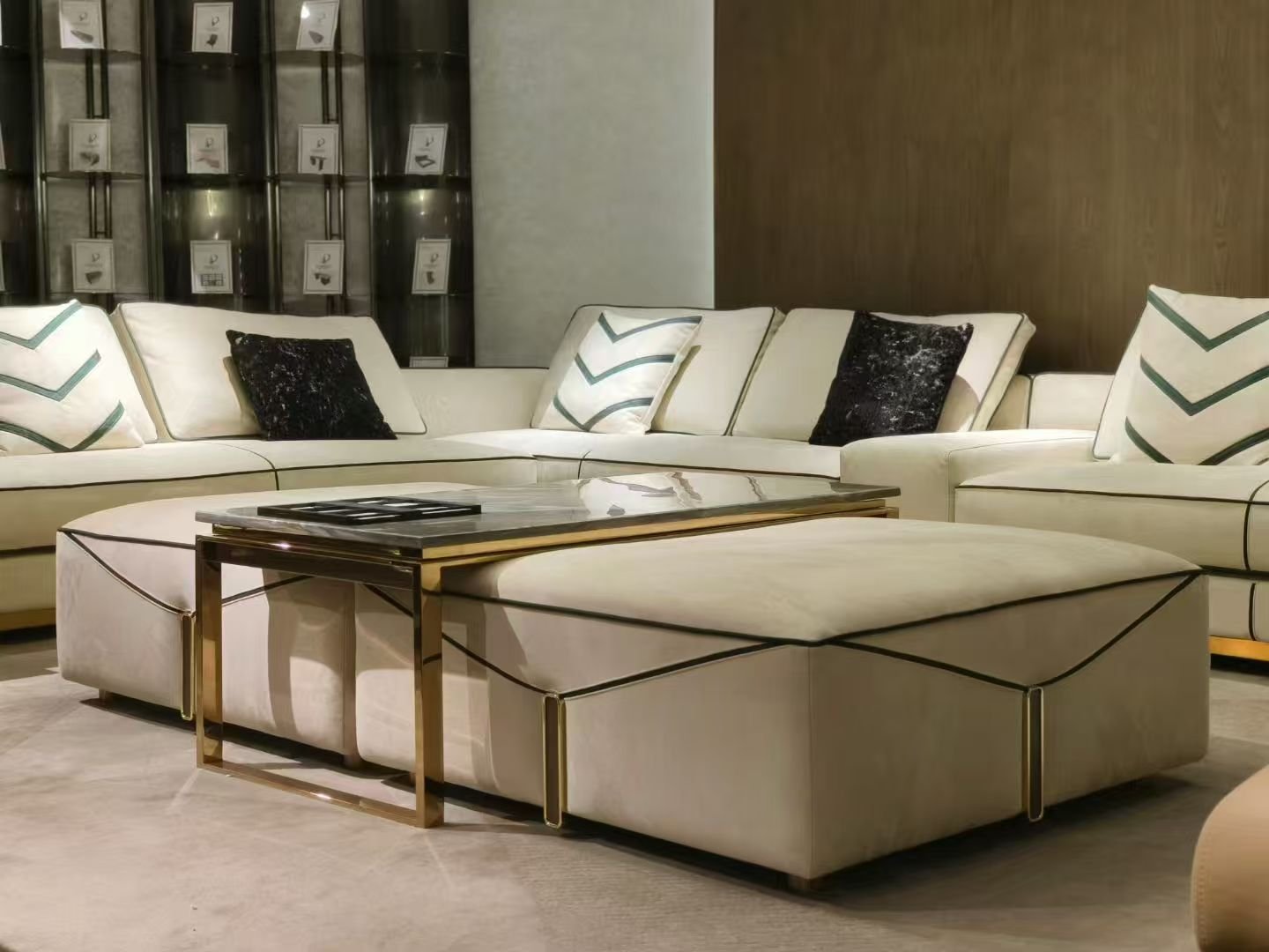 Luxury ottoman footrest in frosted cloth fabric with square silhouette styled in white and gold living room