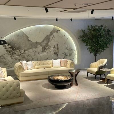White leather sofa gold trim boutique hotel presidential suite interior luxury furniture pristine hospitality design contemporary residential opulent