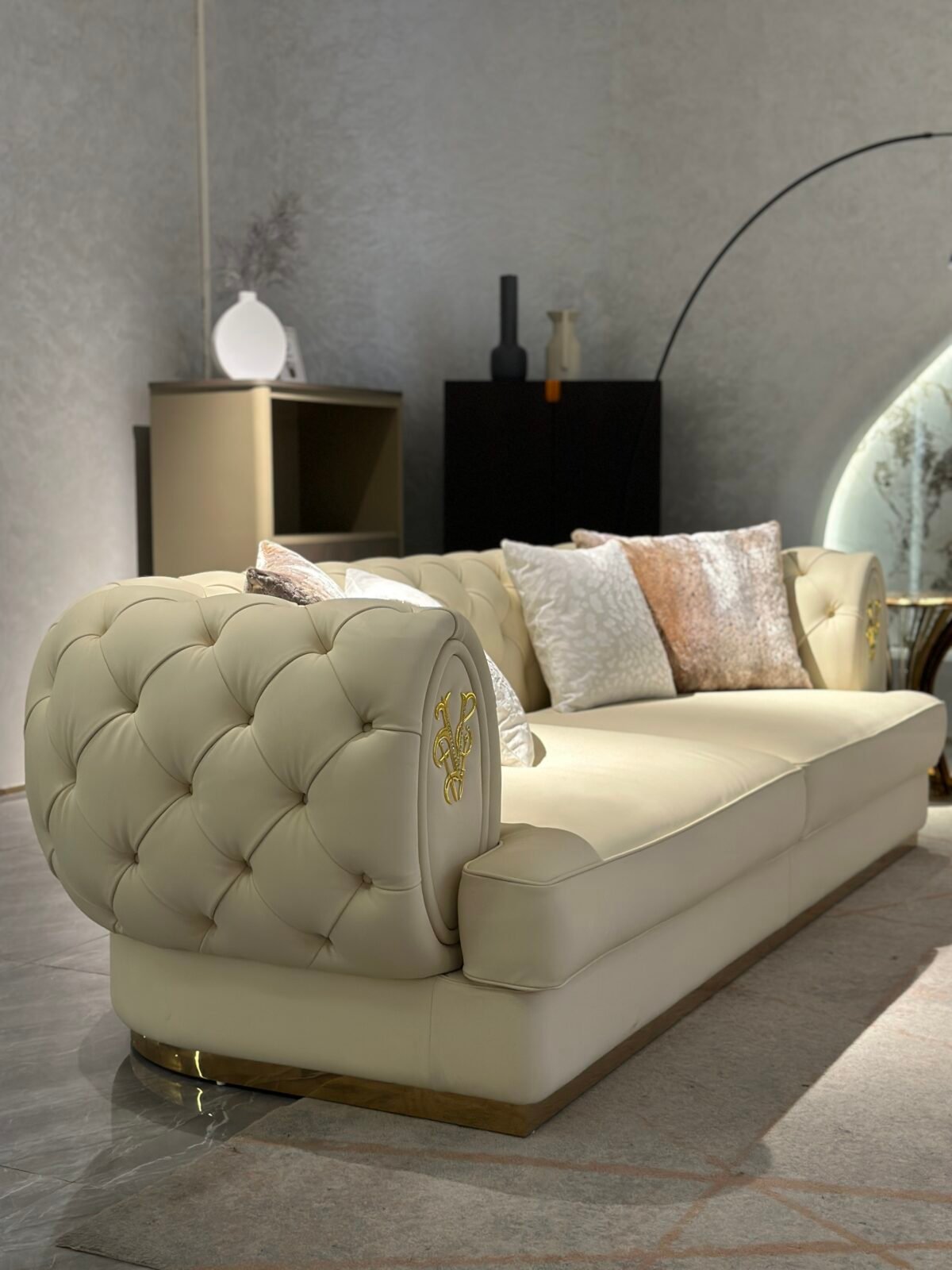 White genuine leather close up texture gold brass trim detail pristine upholstery commercial hospitality furniture craftsmanship quality hardware