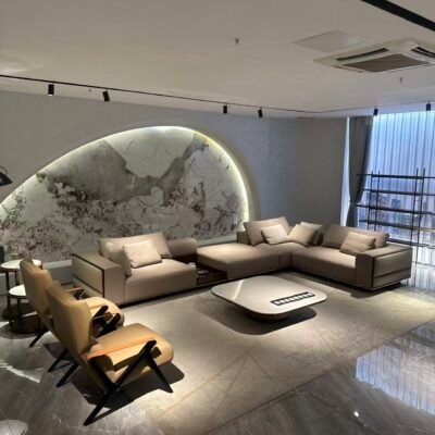 Four piece beige sectional living room set styled in contemporary open plan luxury residence