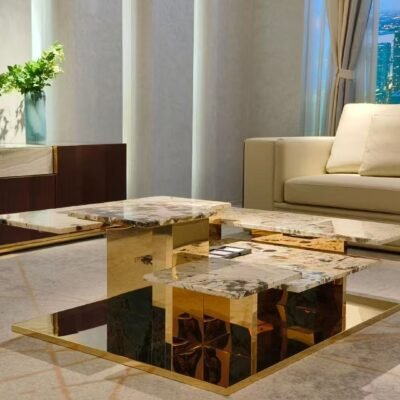 Contemporary elevated stone coffee table for living room office styled in modern residential professional interior titanium gold pedestal