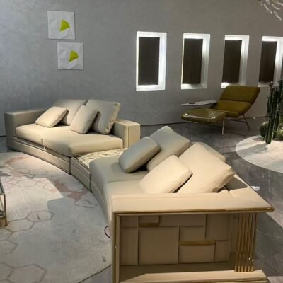 Close-up Tianshan Muxue stone accent and genuine leather surface texture on curved Babylon sofa