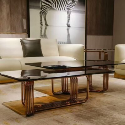 Metal base amber glass lounge coffee table styled in contemporary luxury living room interior