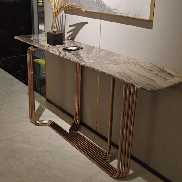 Contemporary stone console table for entrance hall styled in modern residential interior Venetian brown rose gold frame hallway