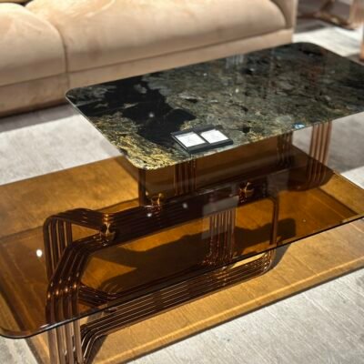 Close-up platinum diamond accent glass living room table surface and copper top finish detail