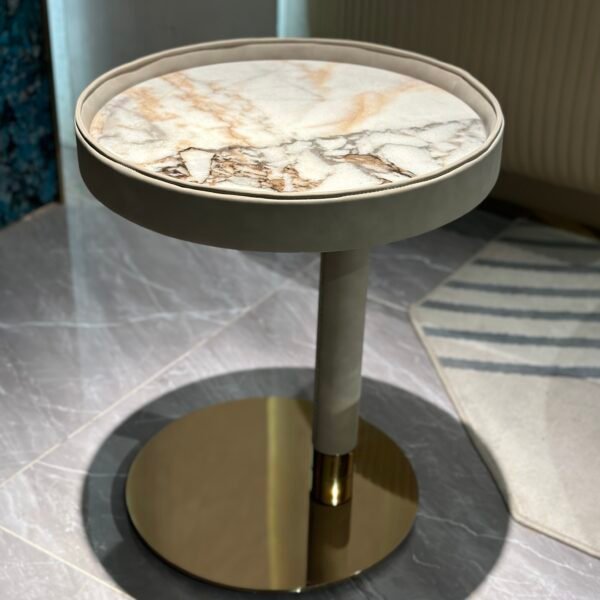 Contemporary marble side table brown copper finish styled in modern residential living room bedroom interior