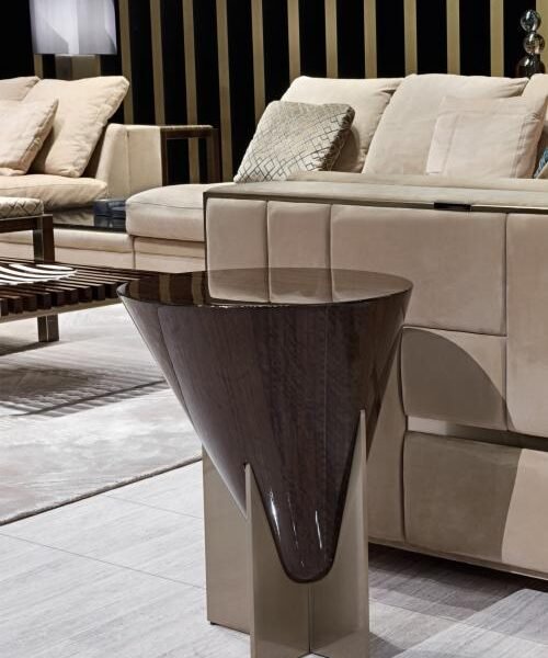 Contemporary wood accent table for living room bedroom styled in modern residential interior eucalyptus bronze gold