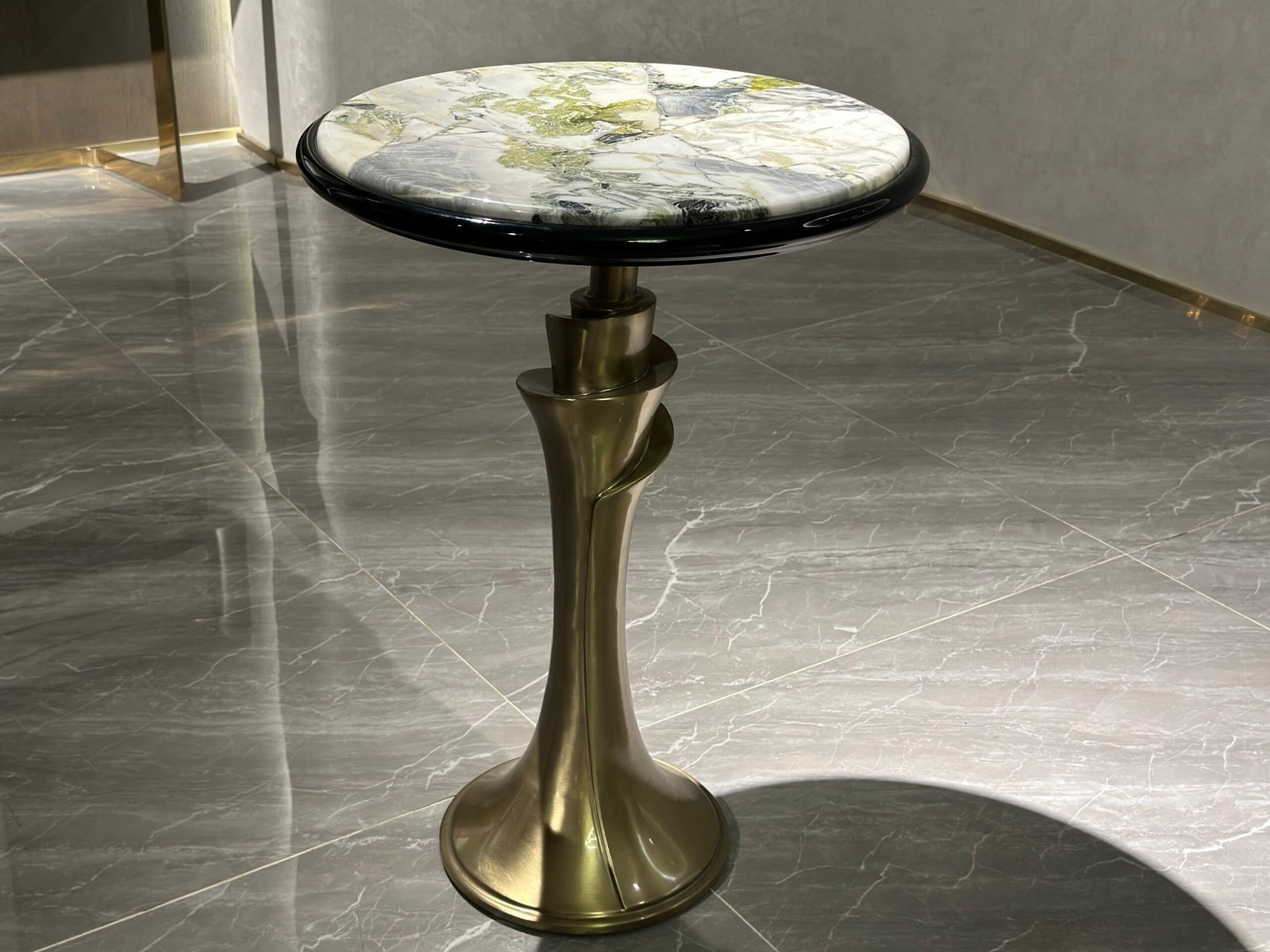 Contemporary glass accent table for living room styled in modern residential interior cool jade black base
