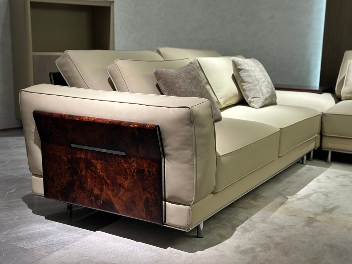 Close-up wood grain matte finish texture and genuine leather upholstery on corner sofa unit