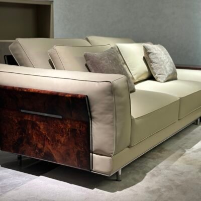 Close-up wood grain matte finish texture and genuine leather upholstery on corner sofa unit