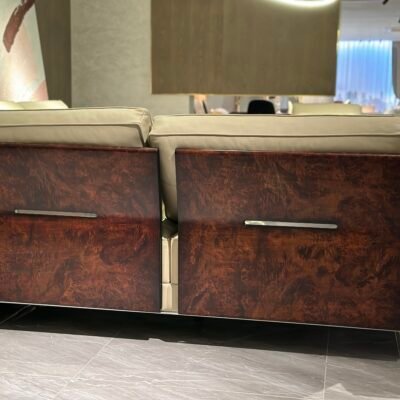 Close-up wood grain matte finish texture and genuine leather upholstery on corner sofa unit