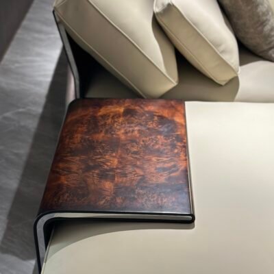 Close-up wood grain matte finish texture and genuine leather upholstery on corner sofa unit