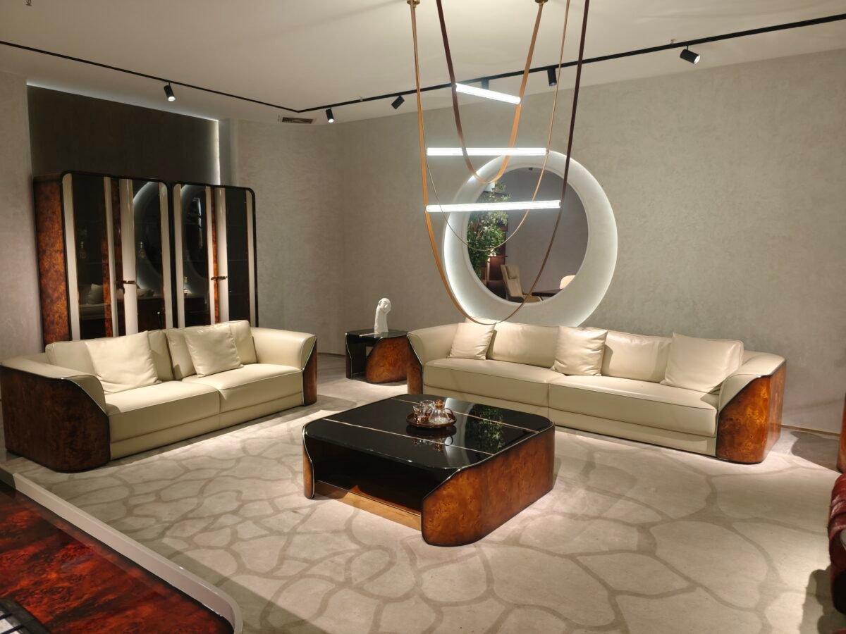 White and burgundy leather living room couch styled in contemporary luxury residence