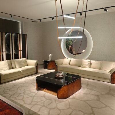 White and burgundy leather living room couch styled in contemporary luxury residence