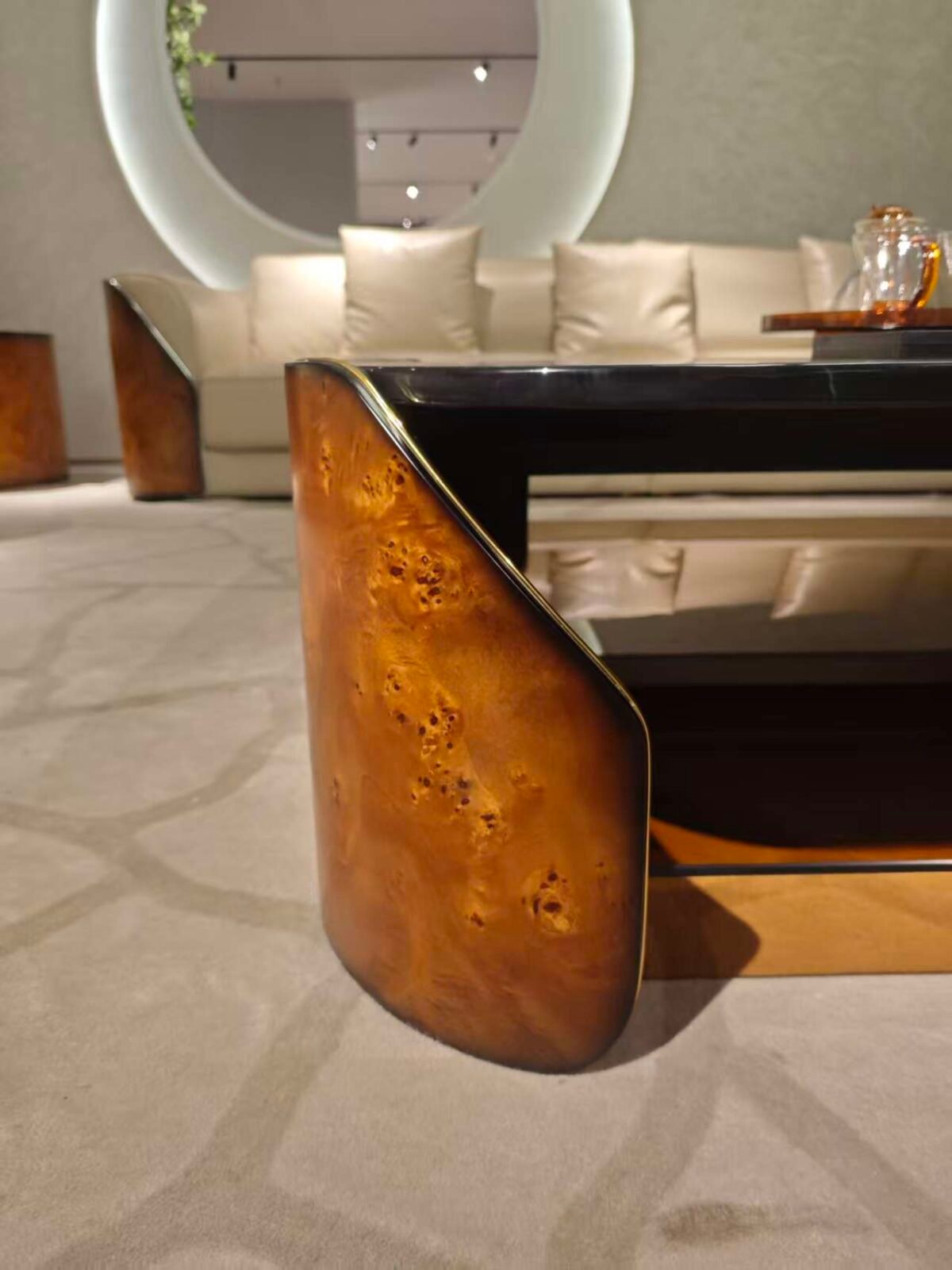 Close-up black marble gold veining coffee table poplar burl three-color finish glass top surface and material layer detail